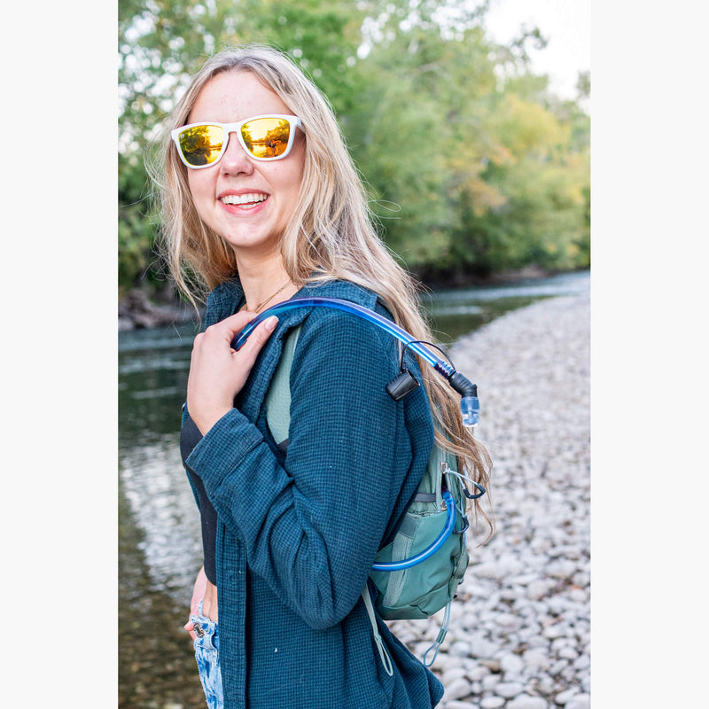 Topo H2O Hydration Reservoir--girl in sunglasses wearing backpack
