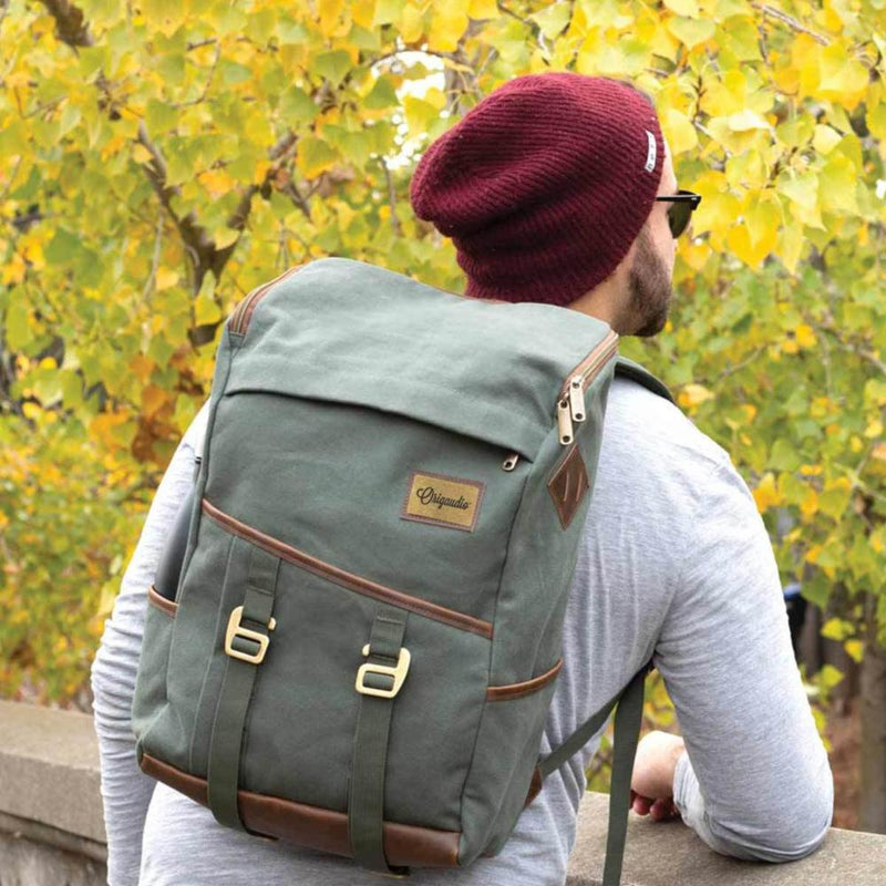 Man in a beanie uses the Green Finley Mill Pack.