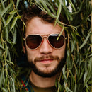 A man wears Eagle Aluminum sunglasses.