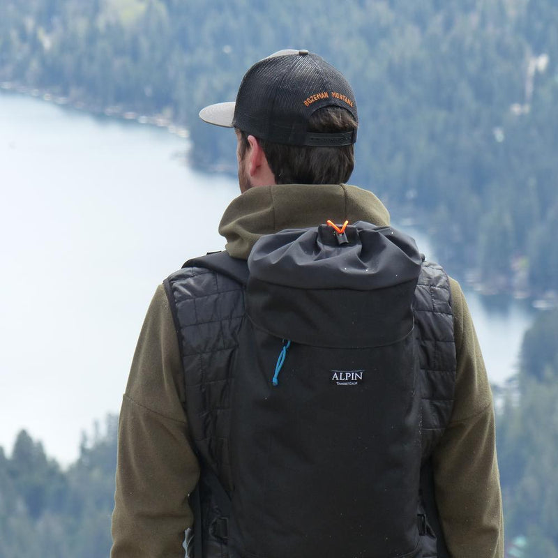 A man wears the Crag Pack.