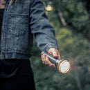 woman pointing flashlight ahead