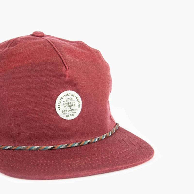 everywhere in between waxed canvas 5 panel cap in burgundy--close up