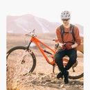 Yuba Long Sleeve Brick Hoodie on a male taking a rest on a bench