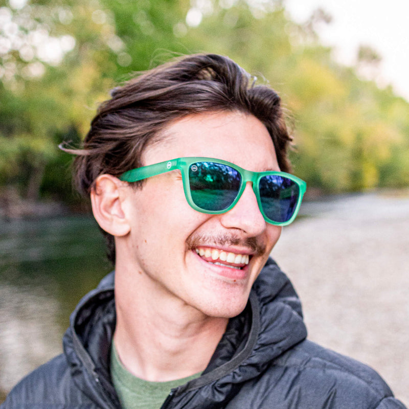 man wearing green sunglasses