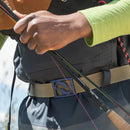 closeup of fly fisherman's belt--holding a fly rod