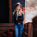 A woman wears the Grip6 Women's Craftsman Bamboo Belt in black.