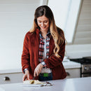 A woman wears the Grip6 Women's Classic Moss Belt in grey.