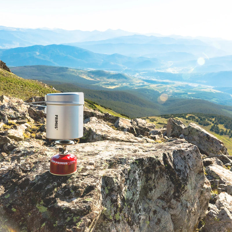 Essential Trail Backpacking Stove--sitting on a mountain side