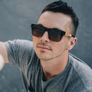 Man wearing Rainier Tortoise Split/Brown Polarized Lens