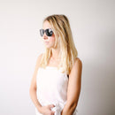 A woman wears proof eyewear for  a headshot.