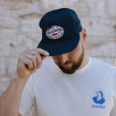 sendero hopper dropper hat - a man tipping his cap