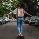 girl skateboarding down the middle of the road
