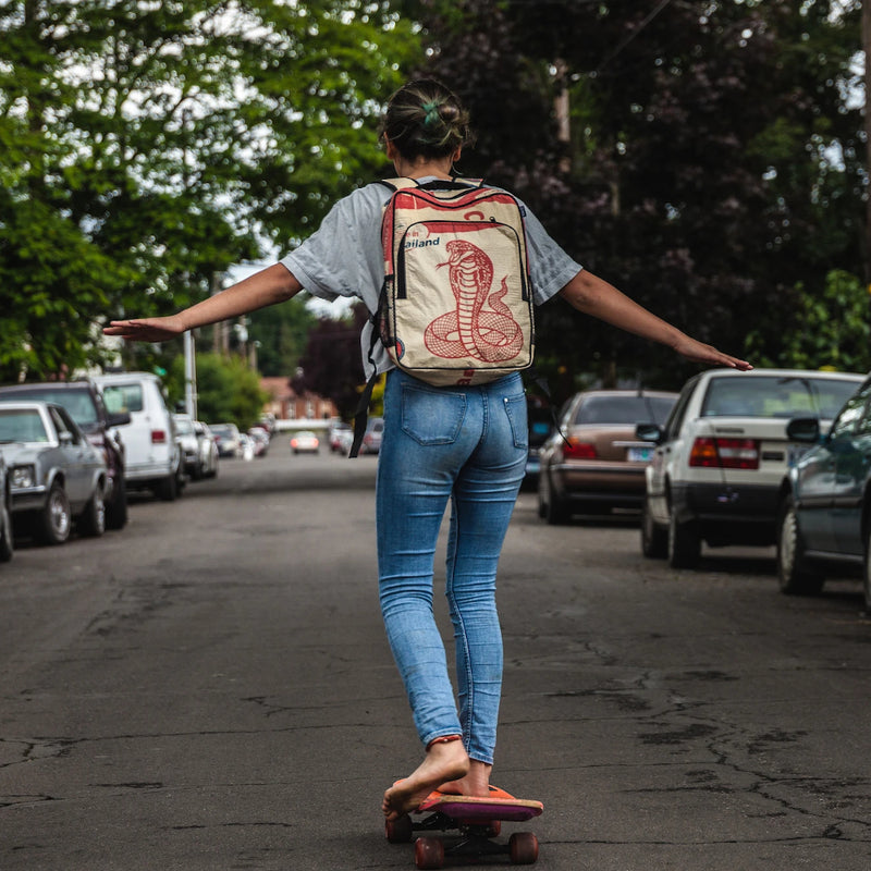 girl skateboarding down the middle of the road
