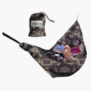 two women relaxing in a hammock