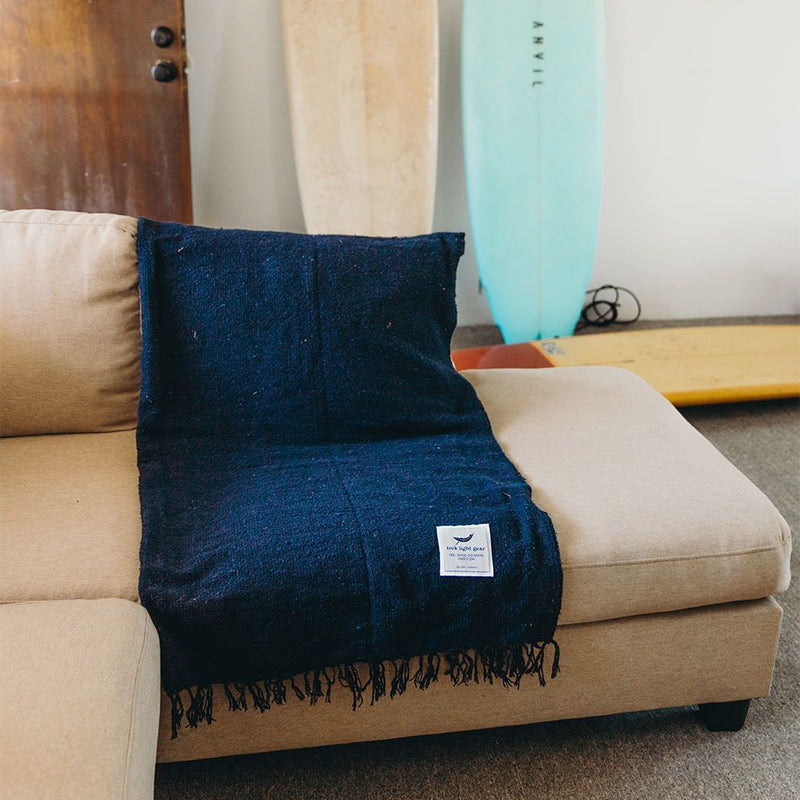 Trek Light Gear Newport Blanket--draped over a couch