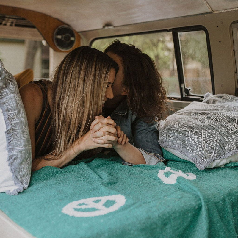 Trek Light Gear Teal Peace Blanket--two women in a van