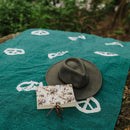 Trek Light Gear Teal Peace Blanket--laying on grass